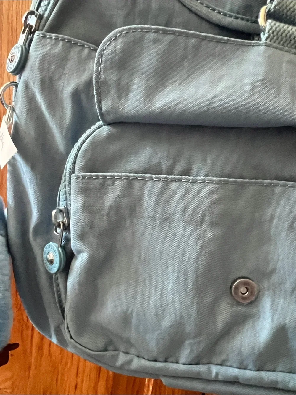 Kipling Dusty Blue Nylon Mini Backpack with monkey bag Charm